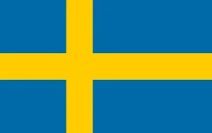 A bandeira da Suécia é azul com uma cruz escandinava dourada nas bordas, refletindo sua rica herança, tradição e identidade nacional.