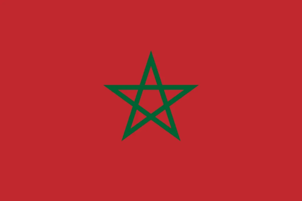 Um campo vermelho com uma estrela verde de cinco pontas no centro, representando a nação de Marrocos, assistir jogos de graça